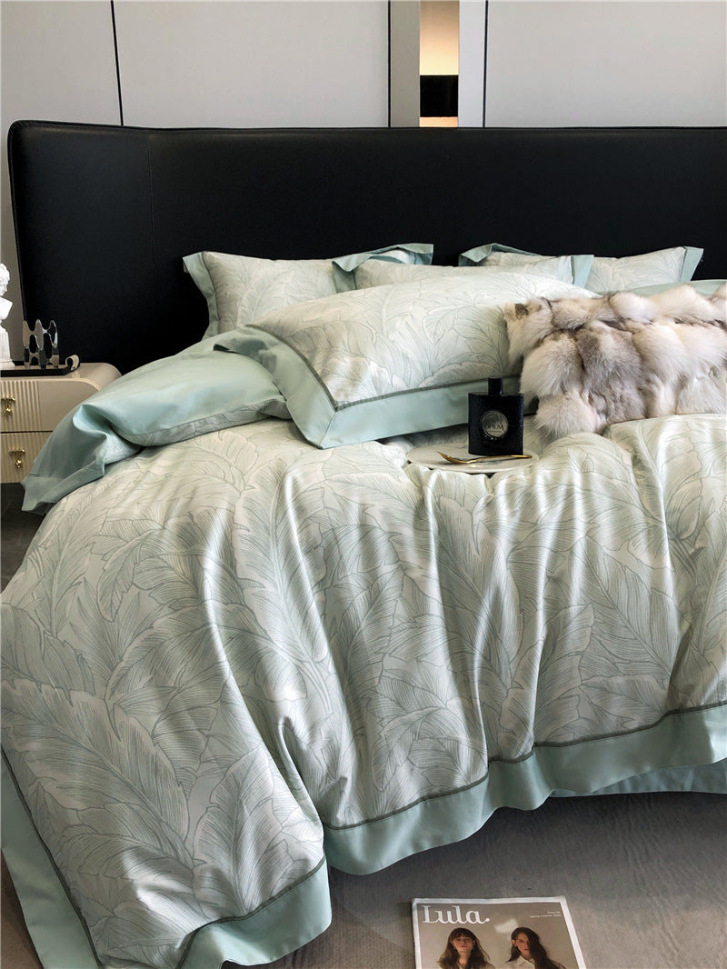 Set di biancheria da letto composto da quattro pezzi in cotone a fibra lunga.