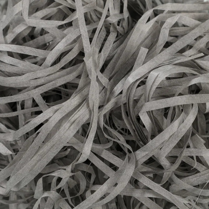 Riempimento per scatole regalo di caramelle in carta crespa triturata color rafia.