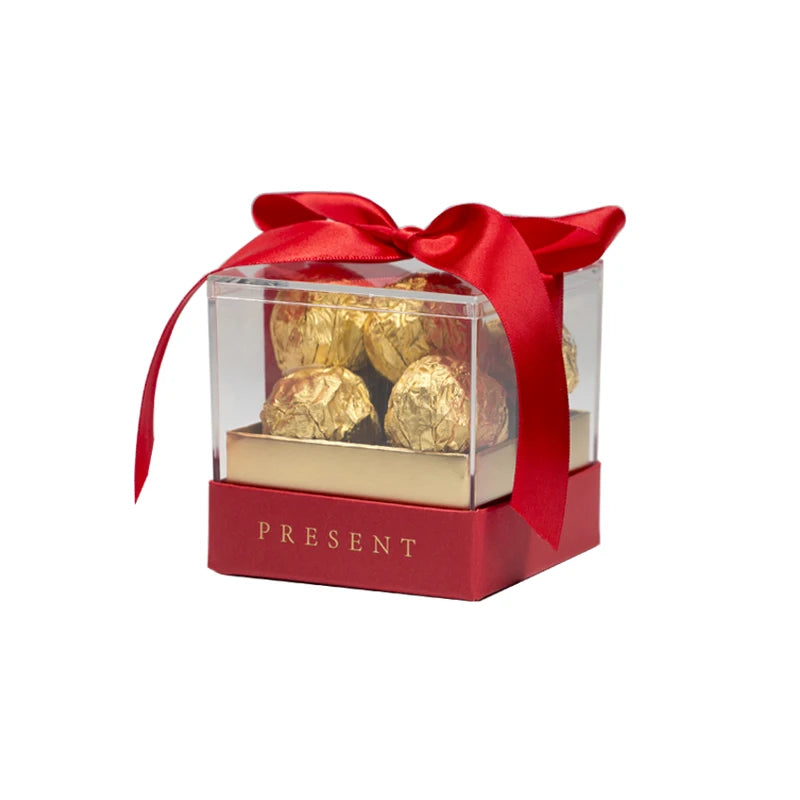 Scatola regalo in acrilico con nastro trasparente.