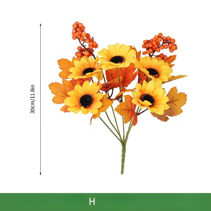 Bouquet di arance natalizie con girasoli artificiali e foglie d'acero