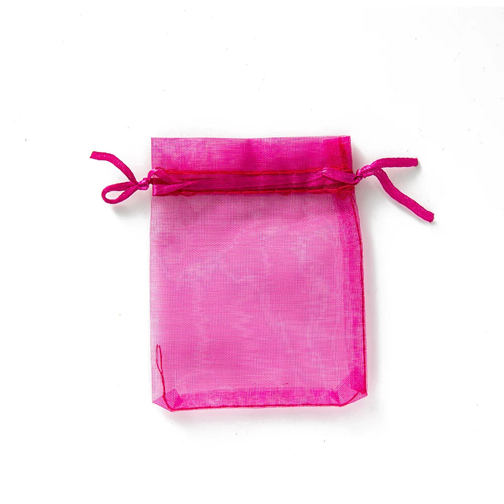 Sacchetti regalo con coulisse color oro e colorati per eventi.