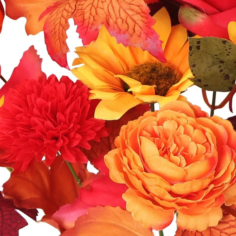 Bouquet di arance natalizie con girasoli artificiali e foglie d'acero