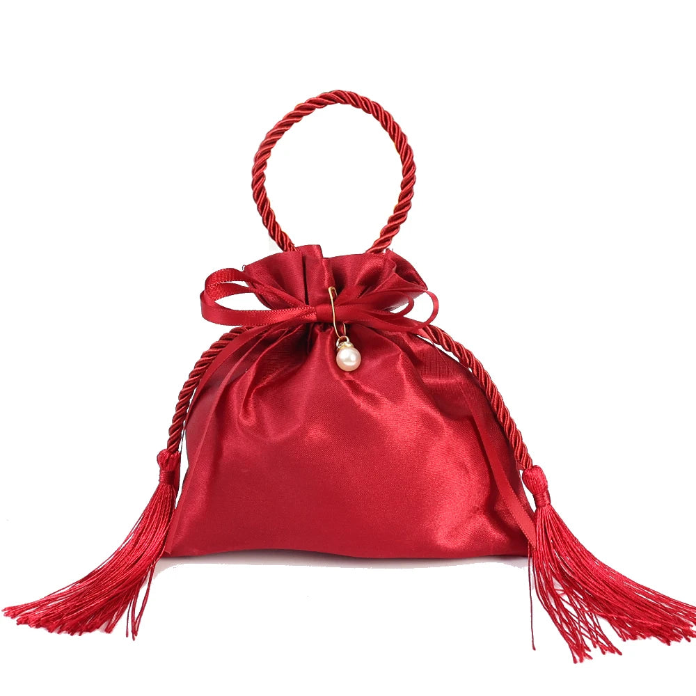 Sacchetto di stoffa con coulisse per i regali degli ospiti delle nozze, colore rosso.