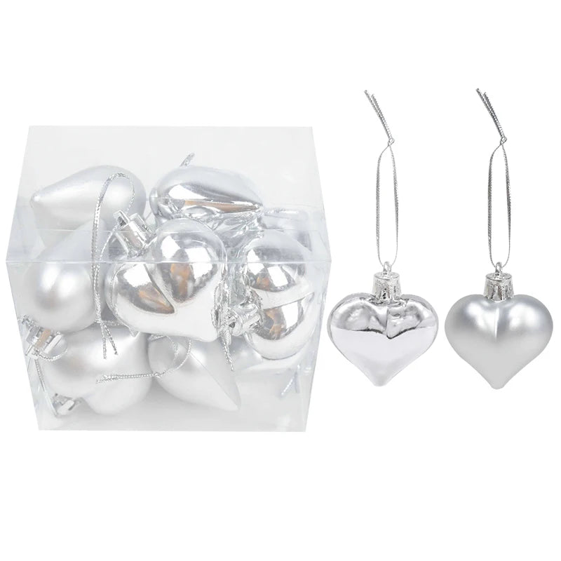 Palline di Natale decorative in plastica color rosa, oro e colori assortiti, confezionate in scatola.