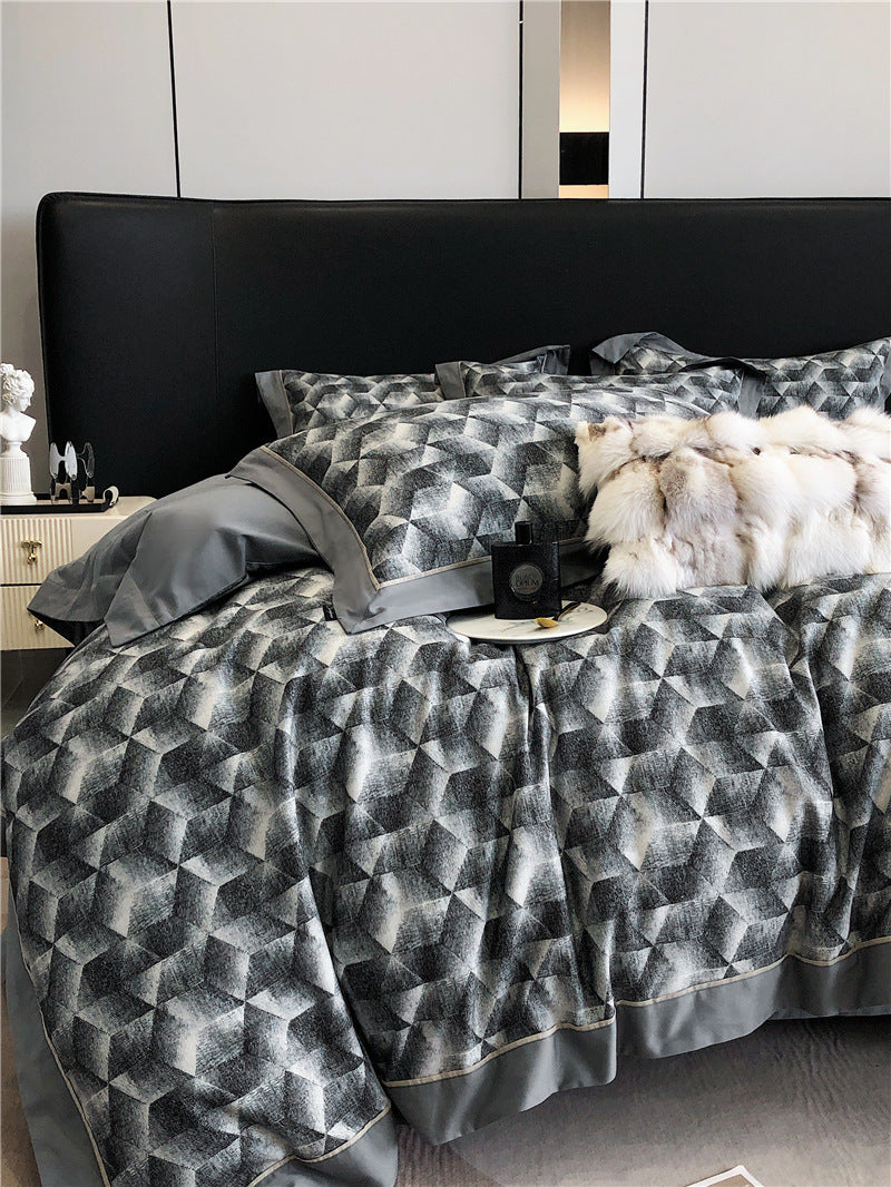 Set di biancheria da letto composto da quattro pezzi in cotone a fibra lunga.